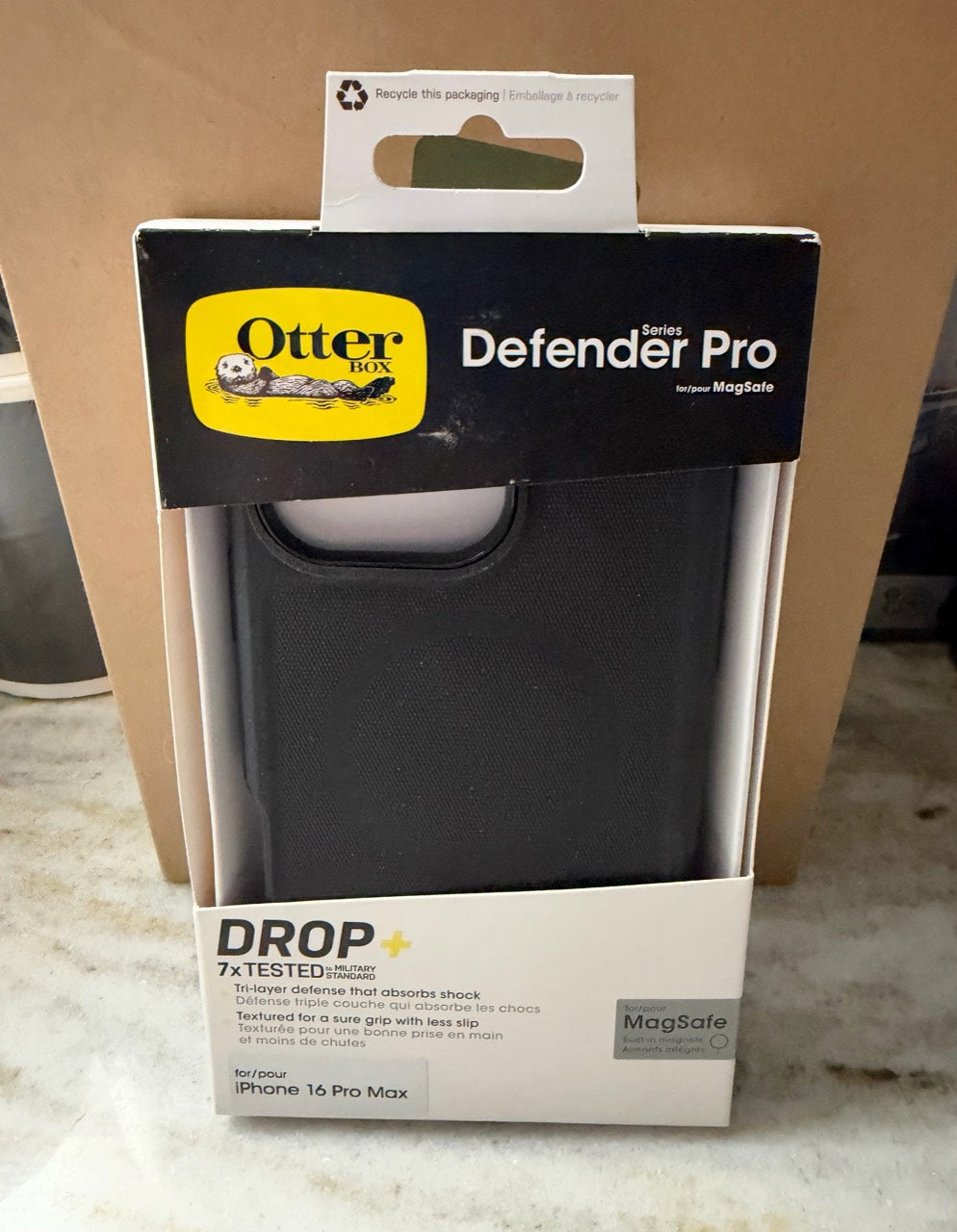 OtterBox Defender Pro case for iPhone 16 Pro Max, rugged protective cell phone case with textured grip and reinforced corners.