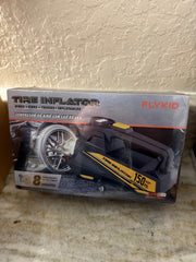 FlyKID tire inflator with digital display and air hose, compact portable device for inflating vehicle tires.