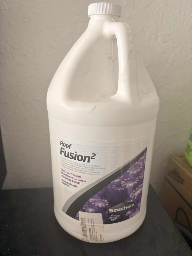 Retro Aquatics Reef Fusion 2-liter liquid supplement bottle with label showing product details and branding.