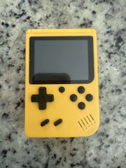 Mini retro handheld game console with 400 classic video games, featuring a compact design and colorful buttons for portable gaming.