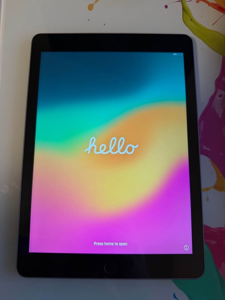 Apple iPad 6th Generation with 128GB storage, showing the device's front screen and sleek design.
