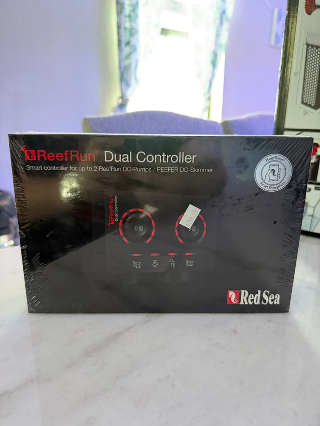 Red Sea ReefRun dual controller for aquarium equipment, showing device with multiple control ports and digital display.