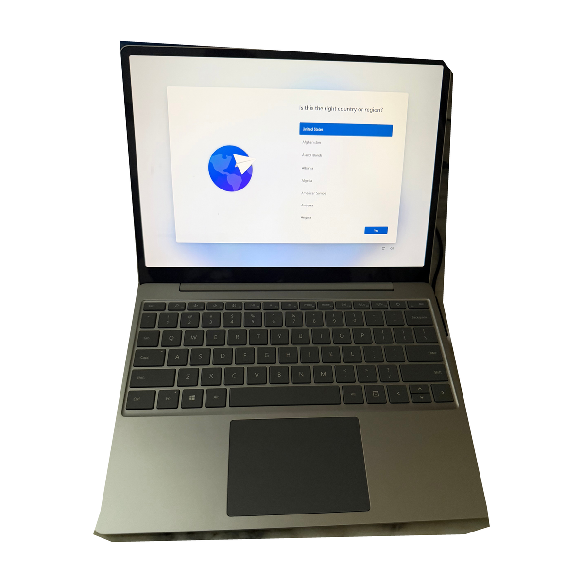 Microsoft Surface Laptop Go open on a desk showing its sleek design and keyboard, highlighting its portable and lightweight build.