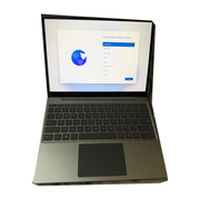 Microsoft Surface Laptop Go open on a desk showing its sleek design and keyboard, highlighting its portable and lightweight build.