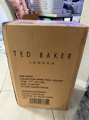 Ted Baker London 3-piece suitcase set featuring stylish luggage with hard shells and telescoping handles for travel.